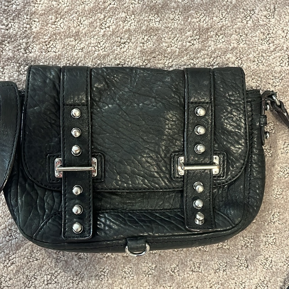 Black buckle Rebecca minkoff cross body bag. Slightly used